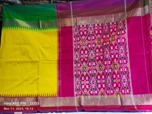 Giving an interesting look, this yellow and pink Patola Silk Saree with Ikat Pattern, elevates the whole look gracefully.